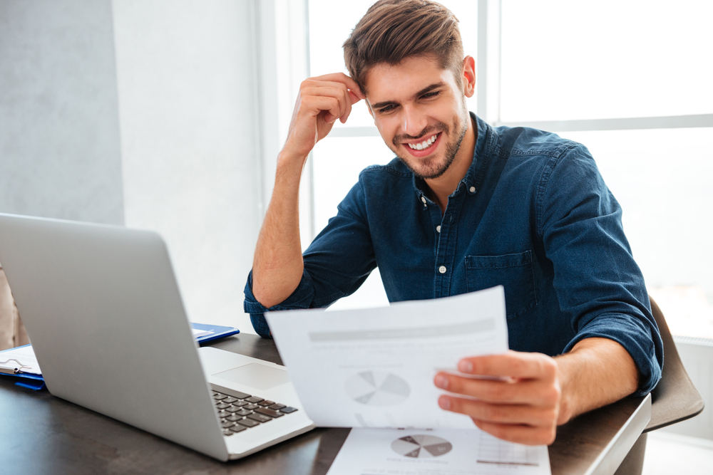 Happy man with lower energy bills