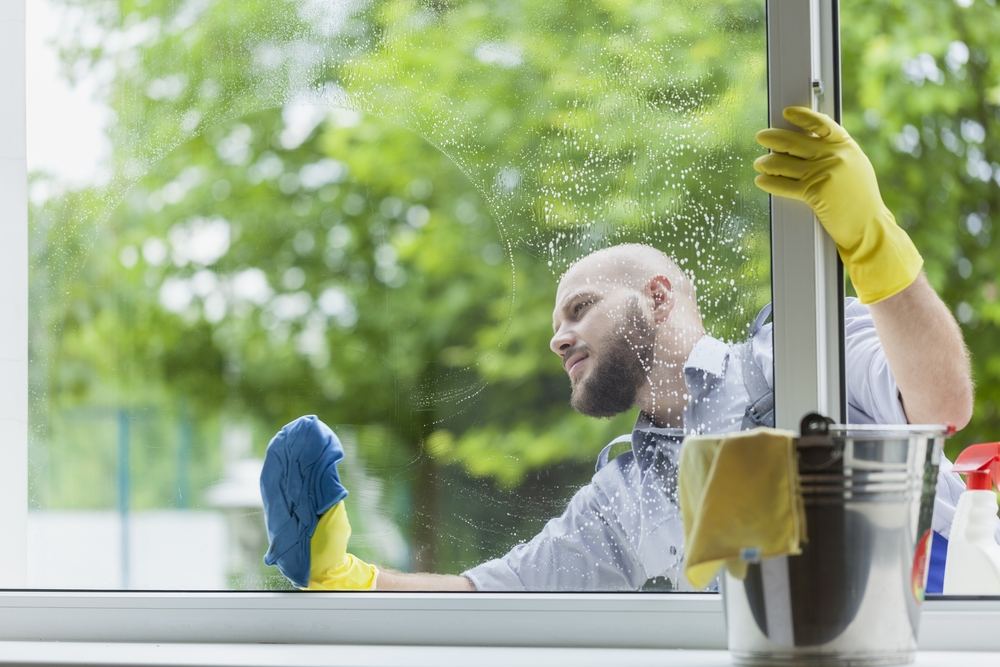 Man cleaning window